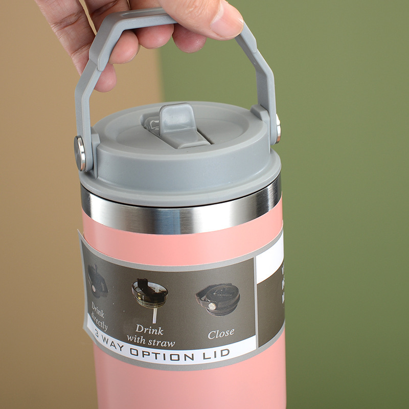 pink vacuum insulated mug with handle display