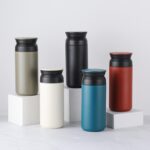 beige, white, black, blue and red thermo custom tumbler