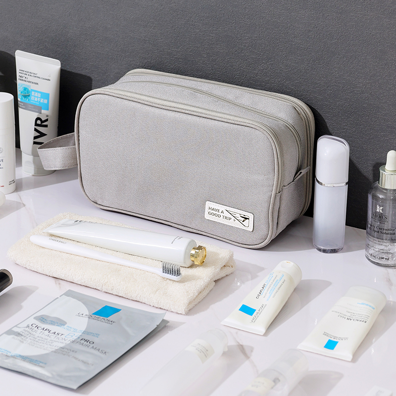 display the beige custom toiletry bag with the accessories needed for travel
