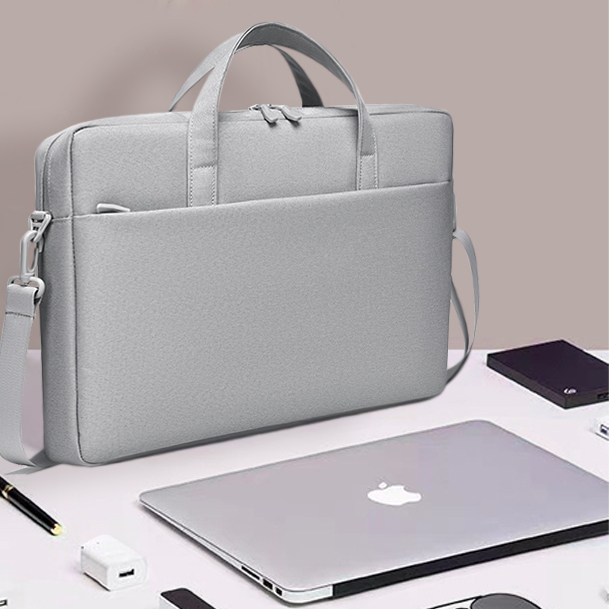 silver hand carry laptop bag with custom company logo set by laser engraving or embroidery services