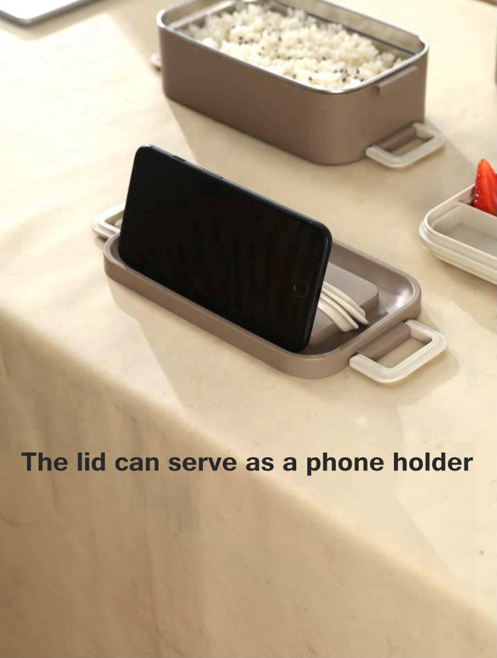 Custom lunch box with multifunctional lid that can serve as a phone holder