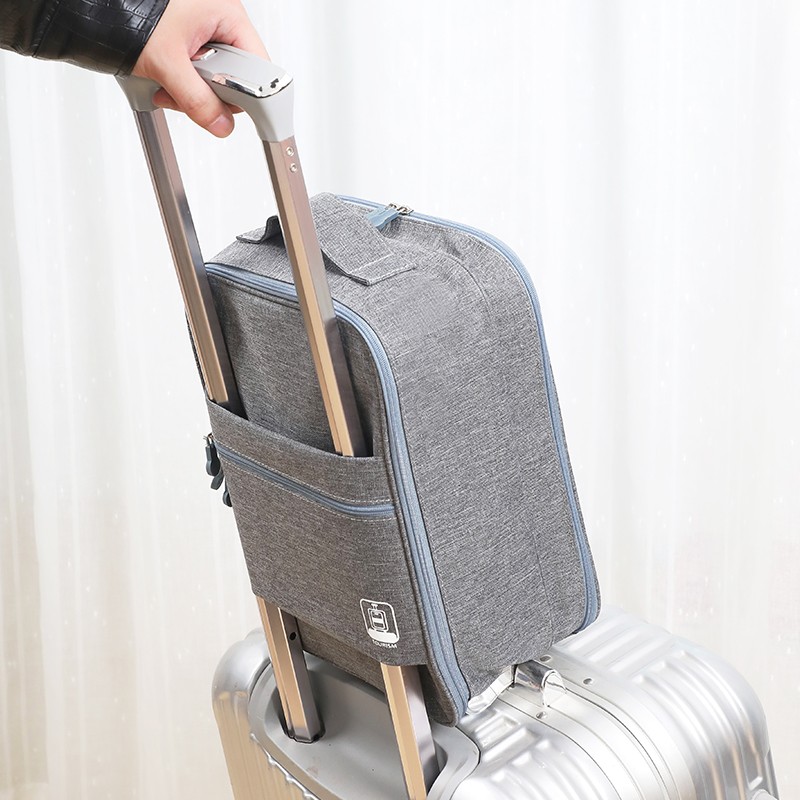 grey travel organizer shoe bag attached with your luggage