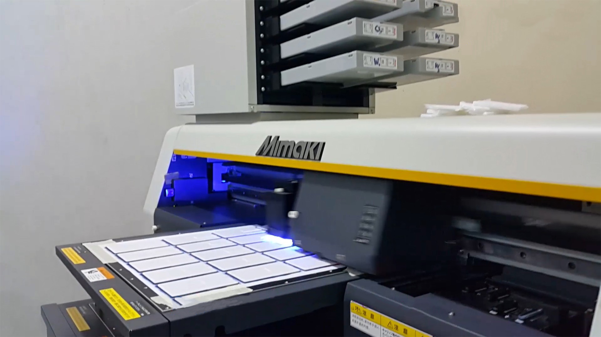 High-precision Mimaki UV printer producing custom printed labels, ideal for corporate gift printing and branding needs.